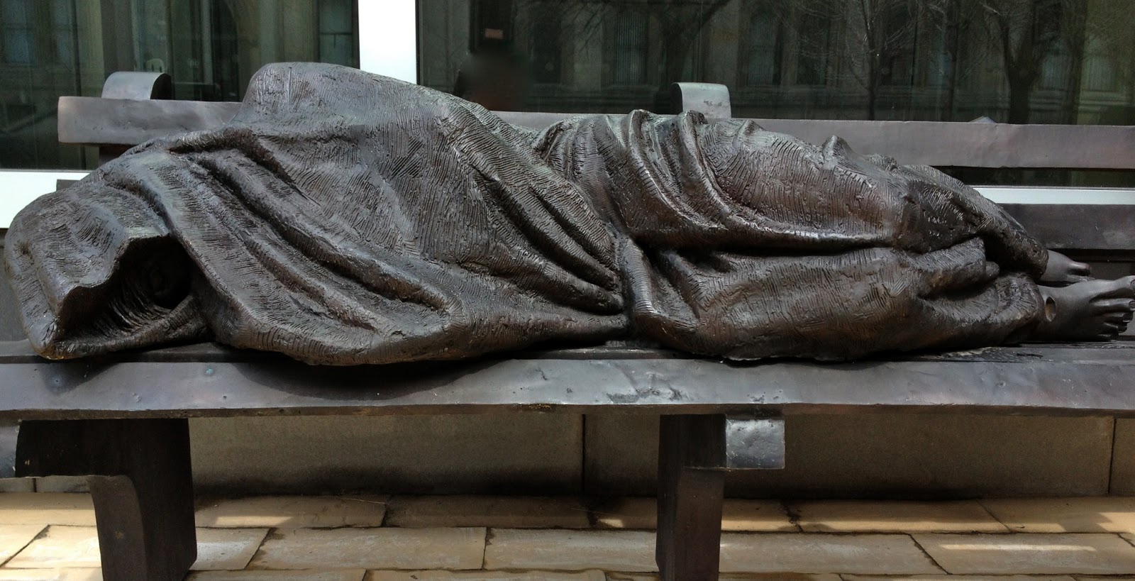 Homeless Jesus statue outside of Regis College