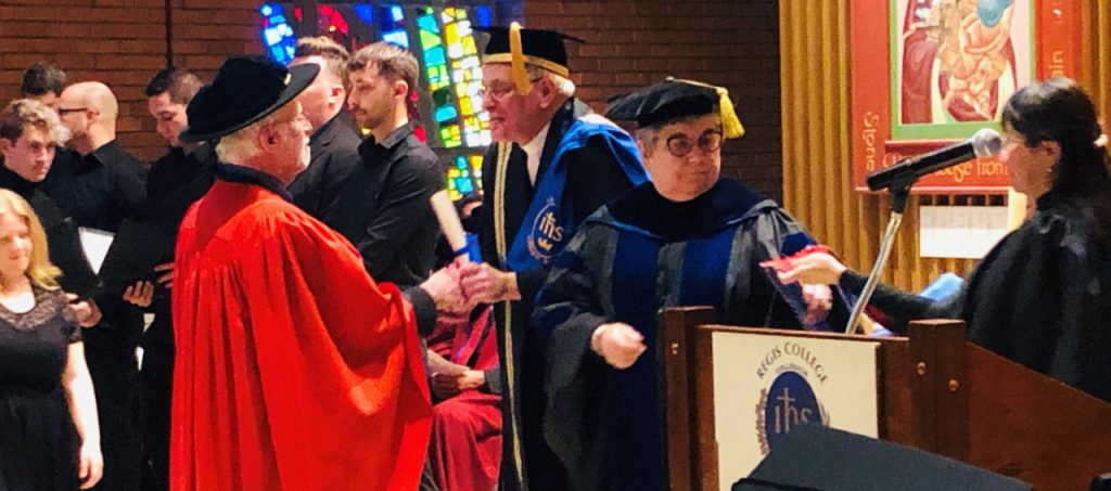 Rev. Dr. Francis X. Clooney, SJ, receives an honourary doctorate from Erik Oland, SJ, Chancellor of Regis College